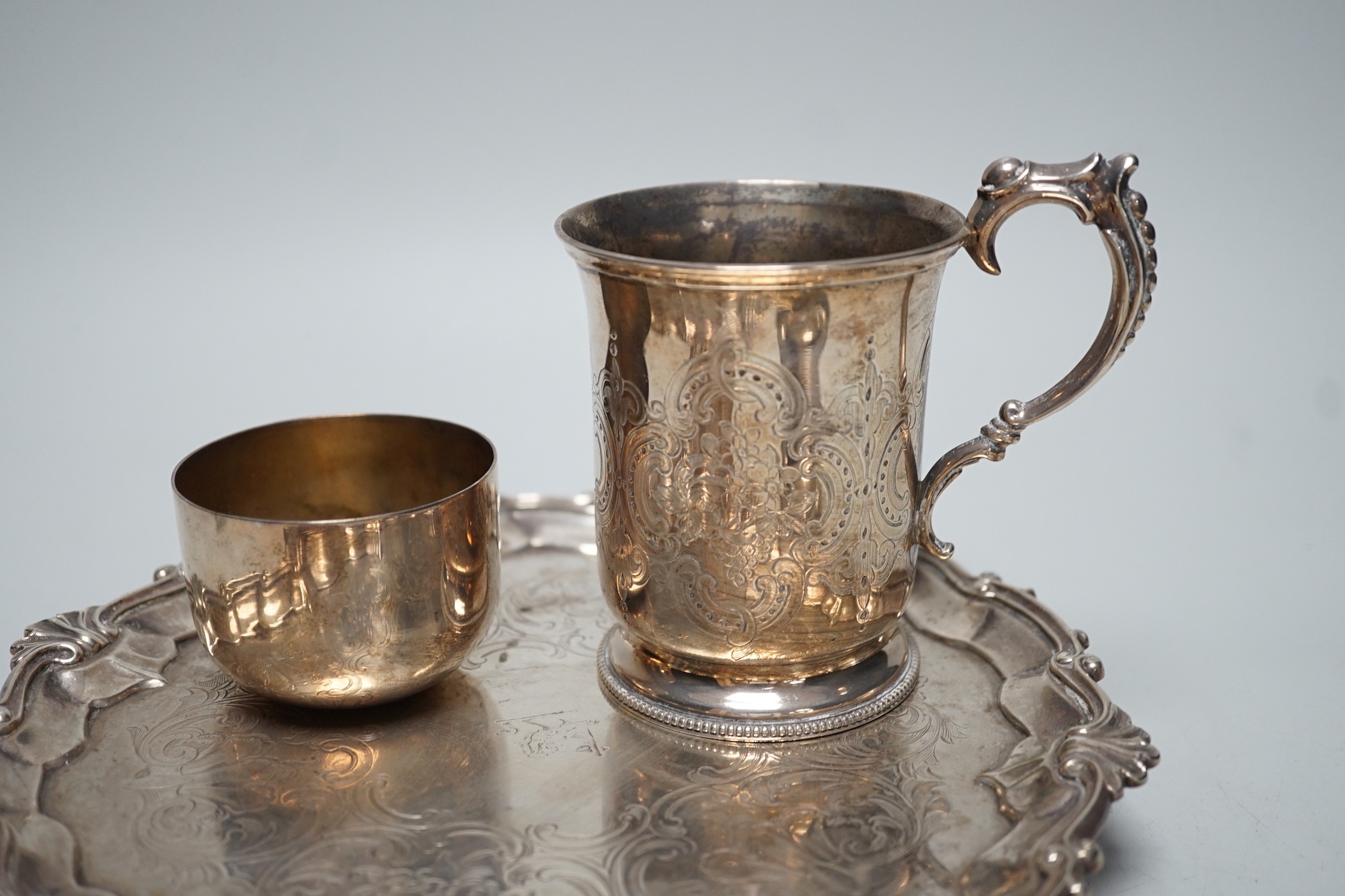 A Victorian silver salver, by The Barnards, London, 1847, 23.1cm, together with a chased silver christening cup, a presentation pin dish, a further novelty dish in the form of a bonnet and a George III silvetr tumbler cu